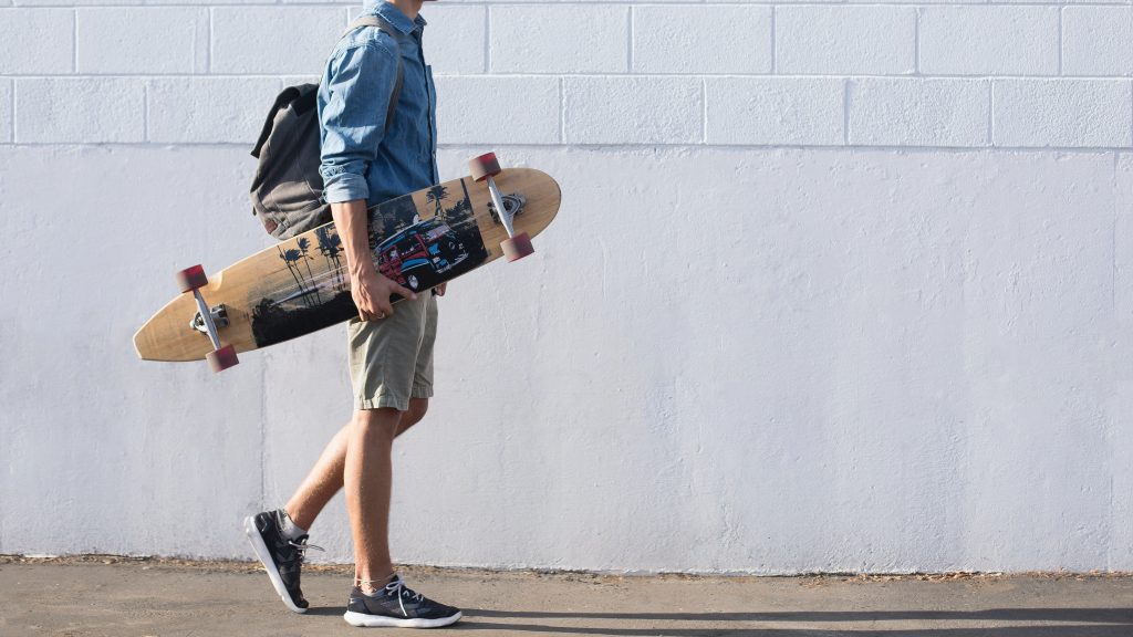 how to carry a longboard